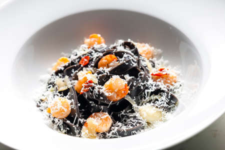 sepia tagliatelle with shrimps and parmesan cheese