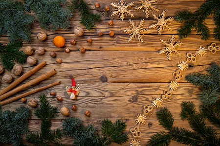 Traditional Czech Christmas on wood decoration with twig, apple, orange, fruitの写真素材