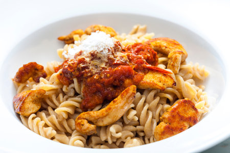 pasta fusilli with spicy chicken meat and tomato sauceの写真素材