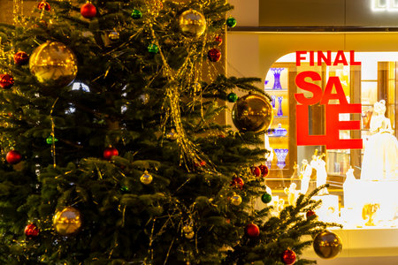 detail of Christmas tree and shop window with final sale sign, Prague, Czech Republicの写真素材