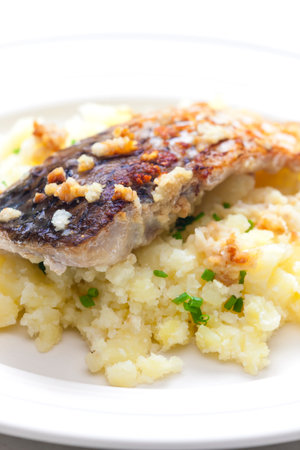 grilled carp with garlic served with mashed potatoesの写真素材