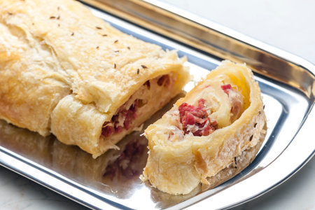 crispy pastry filled with smoked meat and sour cabbageの写真素材