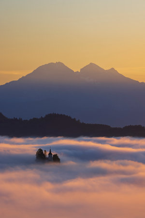 Landscape with St. Thomas Church (Cerkev Sveti Tomaz) near Skofja Loka, Sloveniaの写真素材