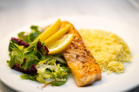 salmon fillet with couscous and vegetables saladの写真素材