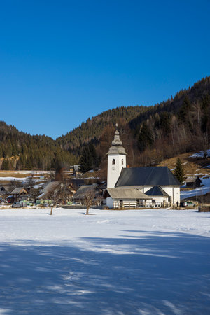 Landscape with church (Cerkev Rozenvenske Marije) near Bohinjska Bistrica, Sloveniaのeditorial素材