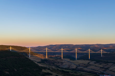Multi-span cable stayed Millau Viaduct across gorge valley of Tarn River, Aveyron Departement,...