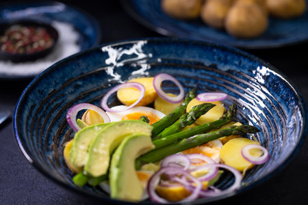 Potato salad with avocado, green asparagus and eggsの写真素材