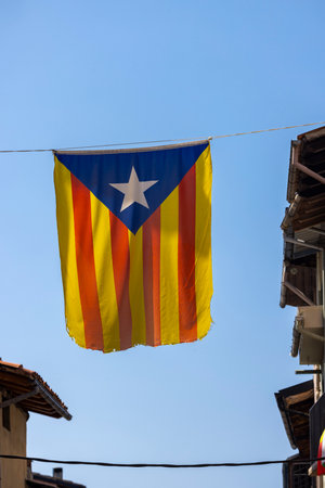 Catalan flag hanging between housesの写真素材