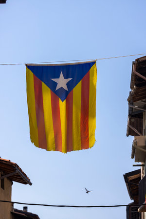 Catalan flag hanging between housesの写真素材