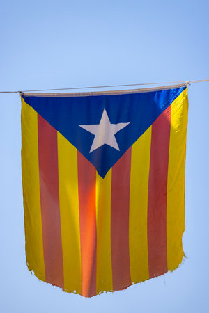 Catalan flag hanging between housesの写真素材