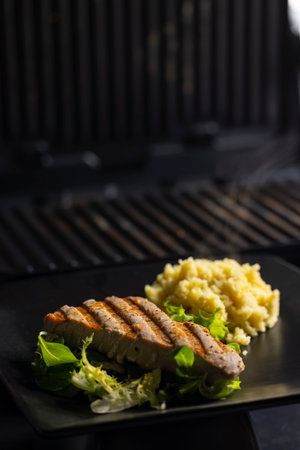 Tuna fish steak with couscous and salad