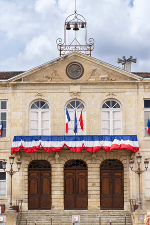The Town Hall of Auch in Place de la Liberation, Occitanie, France, displaying French and European Union flagsの写真素材