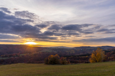 Stunning sunset over the hills and valleys in National park Polana mountains, Slovakiaの写真素材
