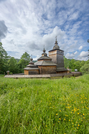 Saint Michael Archangel's Church in Sekowa, Poland, is a UNESCO listed wooden church showcasing traditional Lemko architectureの写真素材