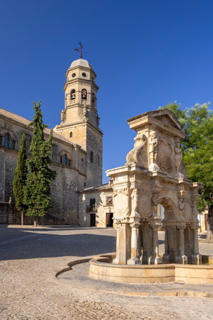 Renaissance style fountain in Santa Maria square with the Cathedral in the background, Baeza, Andalusia, Spainの写真素材