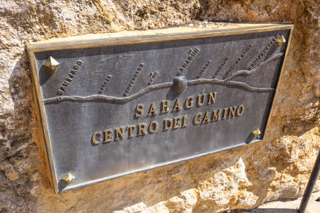 Metal plaque indicating Sahagun as the center of the Camino de Santiago, featuring a stylized map and the scallop shell symbolの写真素材