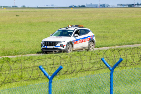 Airport security patrol car monitoring the perimeter of Vaclav Havel Airport Prague in Hostivice,...