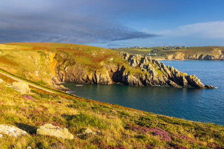 Stunning coastal landscape at Pointe de Kastel Koz in Brittany, France, featuring dramatic cliffs,...