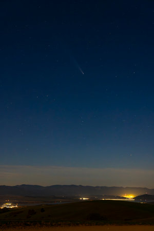 Comet C2022 E3 - ZTF - shining over the hills and mountains of Slovakiaの写真素材