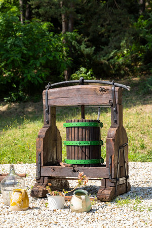 Traditional wooden wine press standing outdoors in Velky Krtis, Slovakia, showcasing the region's viticultural heritageの写真素材