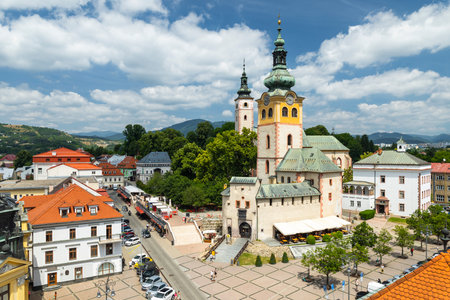 Elevated view of SNP Square with the Church of the Assumption of the Virgin Mary in Banska Bystrica, Slovakia, on a sunny summer dayの写真素材
