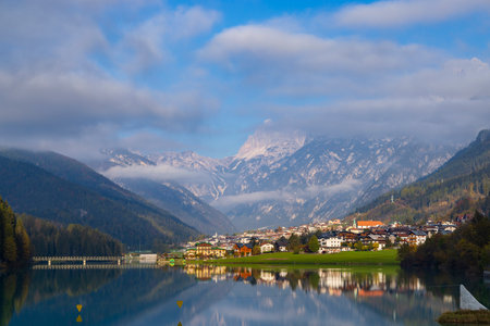 Picturesque landscape of Auronzo di Cadore reflecting in calm watersの写真素材