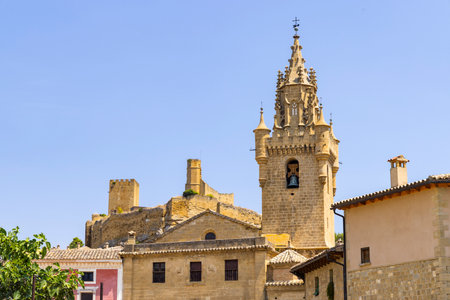 Medieval buildings and church tower under a clear blue skyの写真素材