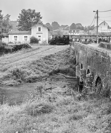 Scenic view of a stone bridge and rural landscape in Franceの写真素材