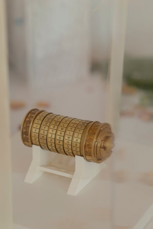 Vintage cipher tool showcased in a protective glass enclosureの写真素材