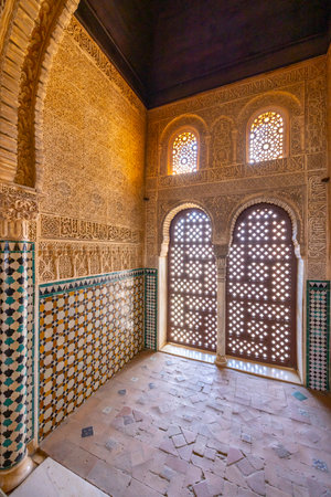 Sunlight streams through ornate windows in Alhambra, Granadaの写真素材
