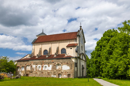 Old church with rustic architecture under a cloudy skyの写真素材