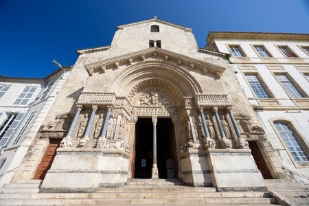 Wide angle view of Saint Trophime Church main entrance with carved statues of saints and apostles, Arles, Provence, Franceの写真素材