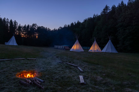 Campfire at dusk in scout camp, Western Bohemia, Czech Republicの写真素材