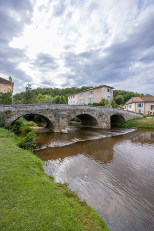 Picturesque view of the old bridge over the Cole river in Saint Jean de Cole, Dordogne, a charming village in Nouvelle Aquitaine, Franceの写真素材