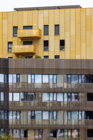 Modern architecture featuring balconies, wooden cladding, and a unique design in Montpellier, France