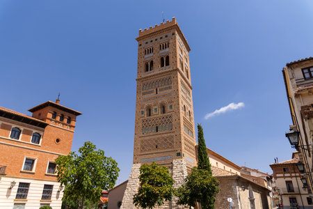 The mudejar architecture of San Martin Tower in Teruel, Aragon, Spain, creates a stunning landmark against the blue skyの写真素材