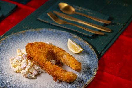 Traditional Christmas dinner in Czech Republic - fried carp with potato saladの写真素材