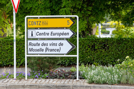 Road sign showing directions to Centre Europeen, France, and Moselle wine region in Schengen, Luxembourgの写真素材