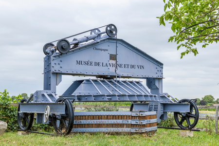 Historic grape press displaying winemaking heritage and viticulture in the Champagne regionの写真素材