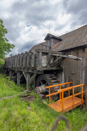 Old wooden water mill showing traditional milling technology and architecture in Medzev, Slovakiaの写真素材