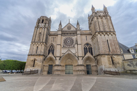 Historic French Gothic cathedral architecture featuring a central rose window and twin towers
