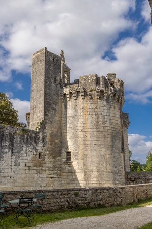 Ancient chateau towers and stone walls on a sunny day in Mareuil en Perigordの写真素材