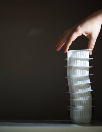 tower of plastic containers from baby food. collection of plastic for recycling.の写真素材