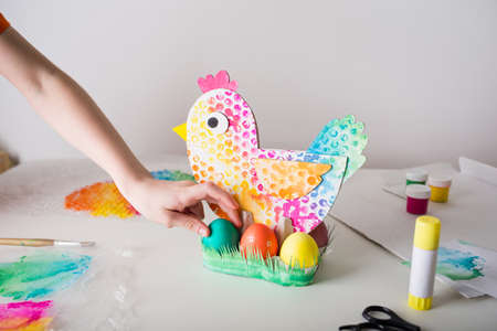 chicken made of cardboard - egg stand. easter decor. craft for kidsの写真素材