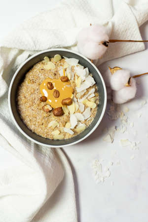 Homemade vegan organic oatmeal for breakfast. Healthy food photography.