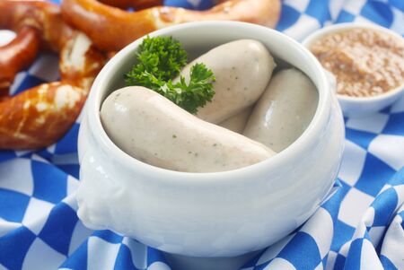 Traditional Bavarian Weisswurst On A Bavarian Flagの写真素材