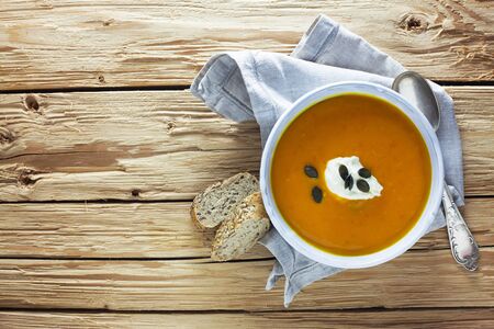 Pumpkin Soup On A Wooden Backgroundの写真素材