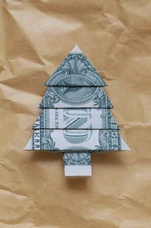 Dollar Bill In The Shape Of A Tree On Brown Paperの写真素材