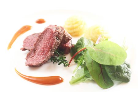 Roast Lamb Slices With Salad And Mashed Potatoesの写真素材