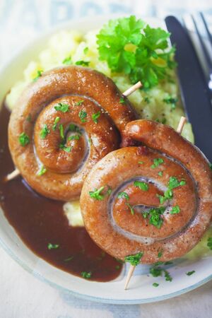 Spiral-Shaped Bratwurst With Mashed Potatoes